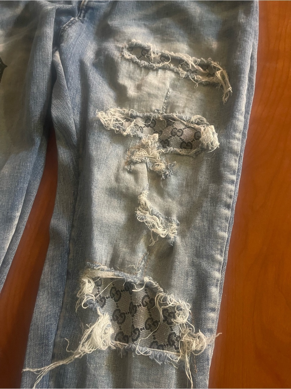 AMIRI Light Blue Distressed Denim Jeans with Patchwork - Picture 2 of 10